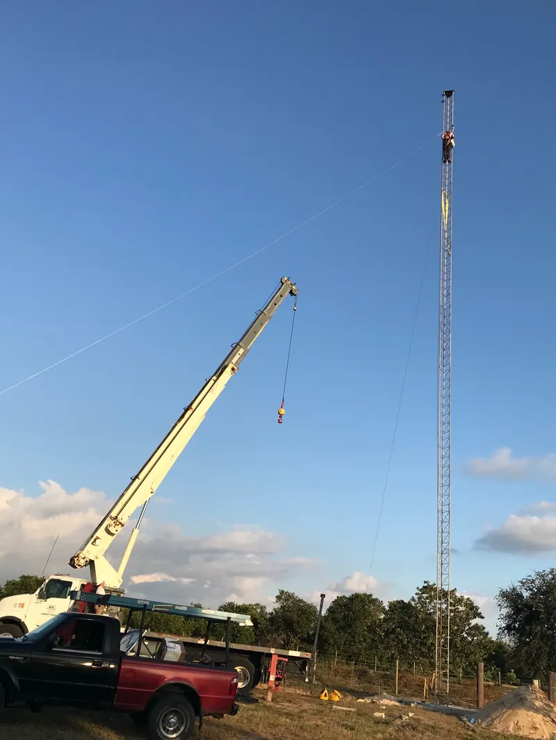 A crane raising a MORnet tower